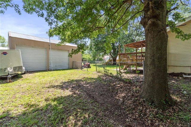 1405 S Vine St, Holden, MO 64040 - view of yard featuring an outbuilding, a garage, and a deck