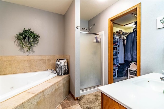 131 NW 171st Rd, Warrensburg, MO 64093 - bathroom with a shower stall, a jetted tub, a spacious closet, and vanity