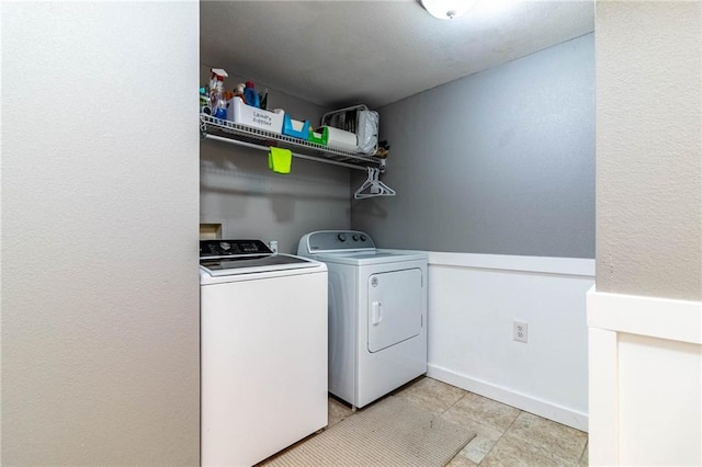 131 NW 171st Rd, Warrensburg, MO 64093 - laundry area featuring washer and dryer and light tile patterned floors