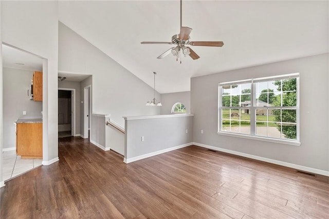 131 NW 171st Rd, Warrensburg, MO 64093 - unfurnished room featuring wood finished floors, ceiling fan, and high vaulted ceiling