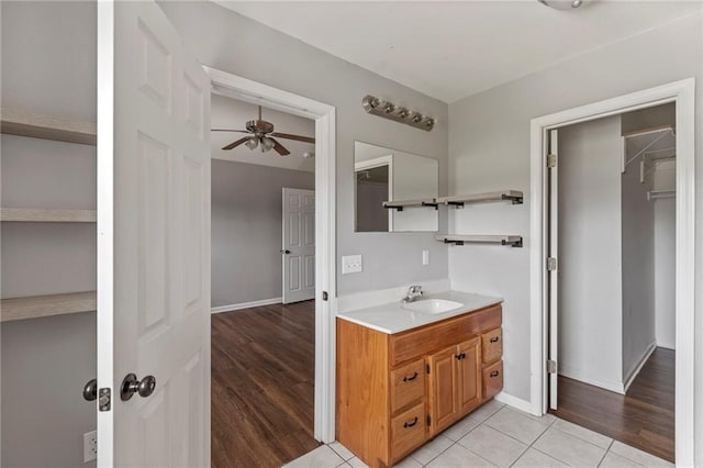 131 NW 171st Rd, Warrensburg, MO 64093 - bathroom featuring ceiling fan, vanity, and wood finished floors