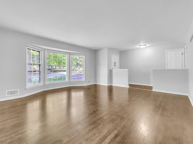 15378 E 45th St S, Independence, MO 64055 - unfurnished living room with wood finished floors and baseboards