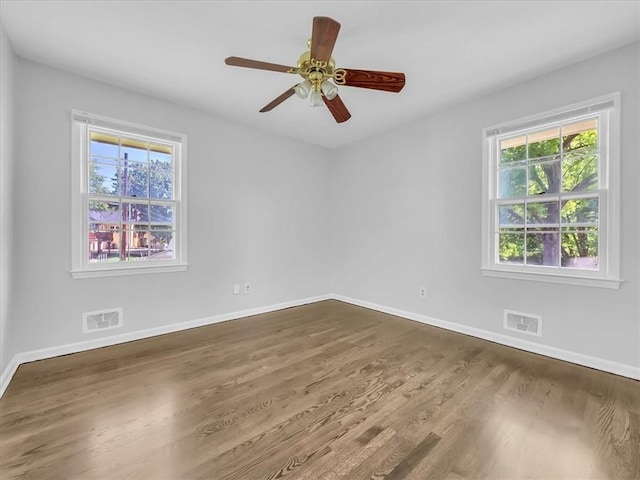 15378 E 45th St S, Independence, MO 64055 - unfurnished room featuring baseboards, wood finished floors, and a ceiling fan