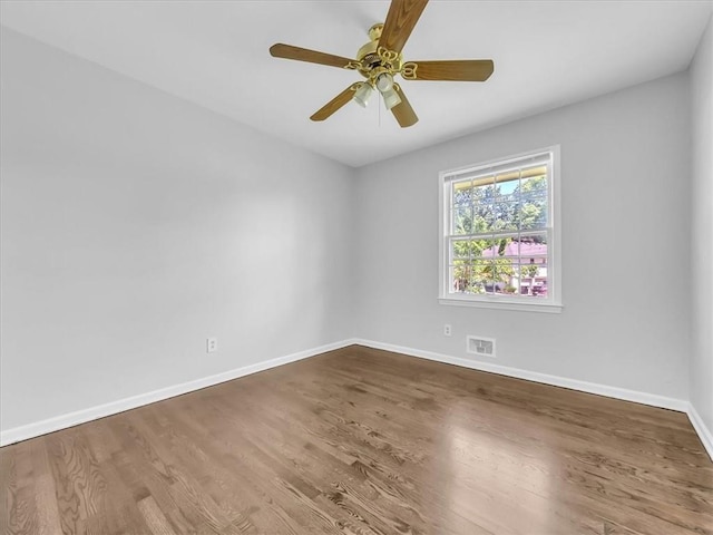 15378 E 45th St S, Independence, MO 64055 - spare room featuring baseboards, wood finished floors, and ceiling fan