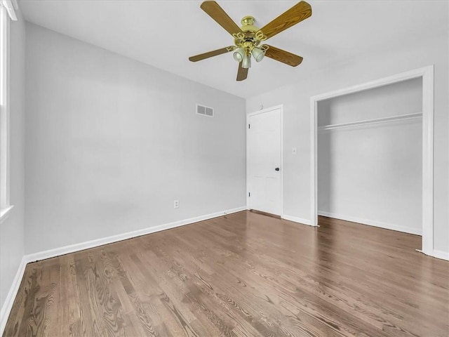 15378 E 45th St S, Independence, MO 64055 - unfurnished bedroom featuring wood finished floors, baseboards, and a closet