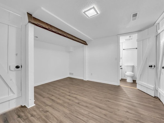 15378 E 45th St S, Independence, MO 64055 - finished basement featuring wood finished floors and baseboards