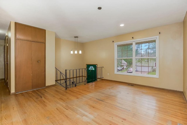 19218 E 6th St N, Independence, MO 64056 - spare room with light wood-style flooring and baseboards