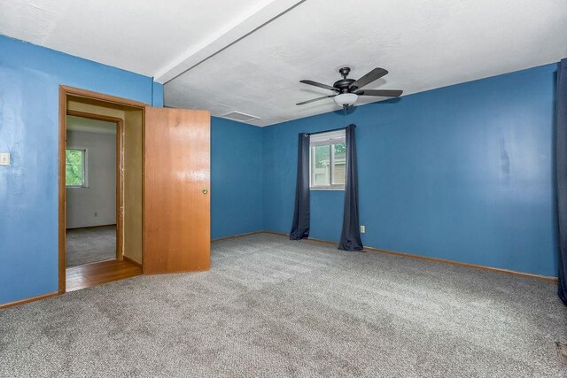 19218 E 6th St N, Independence, MO 64056 - spare room with carpet flooring, a ceiling fan, and baseboards