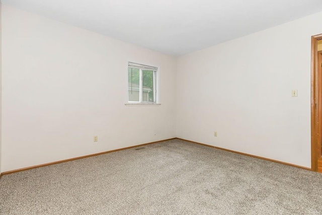 19218 E 6th St N, Independence, MO 64056 - unfurnished room featuring light carpet and baseboards