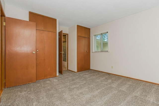 19218 E 6th St N, Independence, MO 64056 - unfurnished bedroom featuring carpet flooring and baseboards