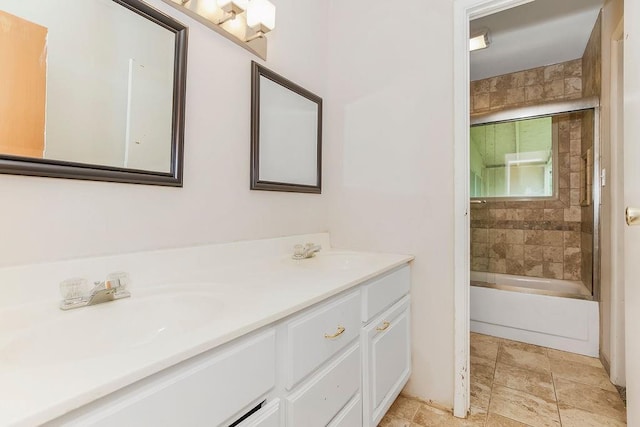 19218 E 6th St N, Independence, MO 64056 - full bathroom featuring double vanity, bathtub / shower combination, and stone finish flooring