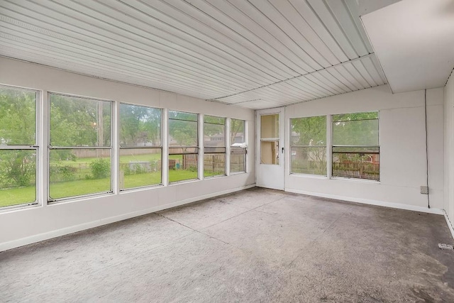 19218 E 6th St N, Independence, MO 64056 - unfurnished sunroom with baseboards and concrete flooring