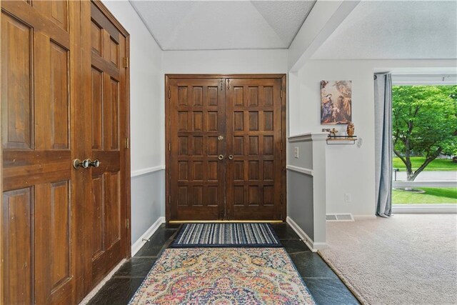 12411 W 100th St, Lenexa, KS 66215 - foyer entrance with baseboards and dark carpet