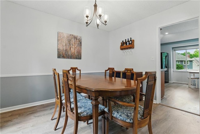 12411 W 100th St, Lenexa, KS 66215 - dining room with a chandelier and wood finished floors