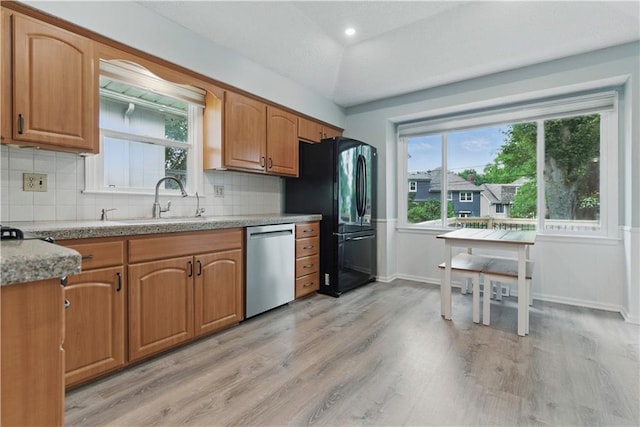 12411 W 100th St, Lenexa, KS 66215 - kitchen with dishwasher, light wood-type flooring, and backsplash