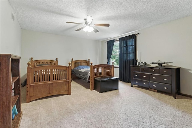 12411 W 100th St, Lenexa, KS 66215 - bedroom with carpet, a textured ceiling, and ceiling fan