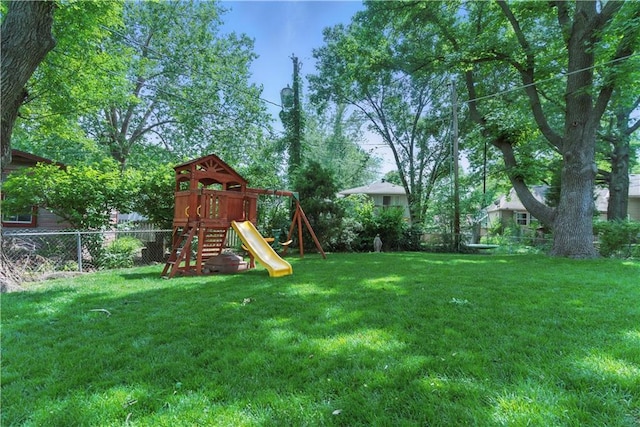 12411 W 100th St, Lenexa, KS 66215 - fenced yard featuring a playground