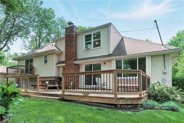 12411 W 100th St, Lenexa, KS 66215 - back of property with a chimney, a shingled roof, a wooden deck, and a yard