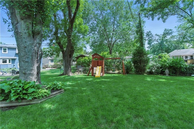 12411 W 100th St, Lenexa, KS 66215 - view of yard featuring a playground