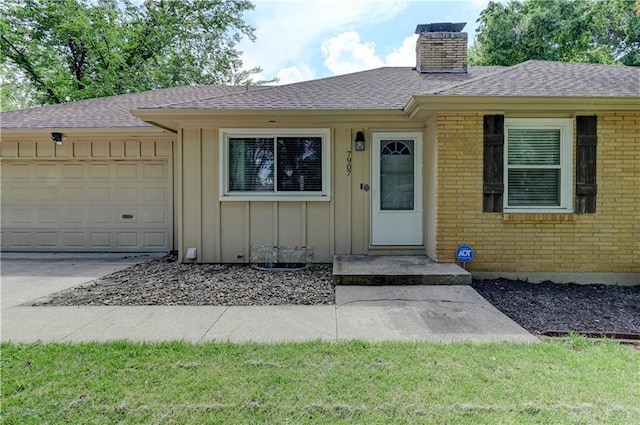 7907 Elm Ave, Raytown, MO 64138 - single story home with board and batten siding, a chimney, an attached garage, brick siding, and a shingled roof