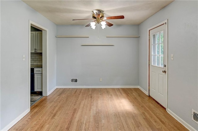 7907 Elm Ave, Raytown, MO 64138 - unfurnished dining area featuring light wood-style floors and a ceiling fan