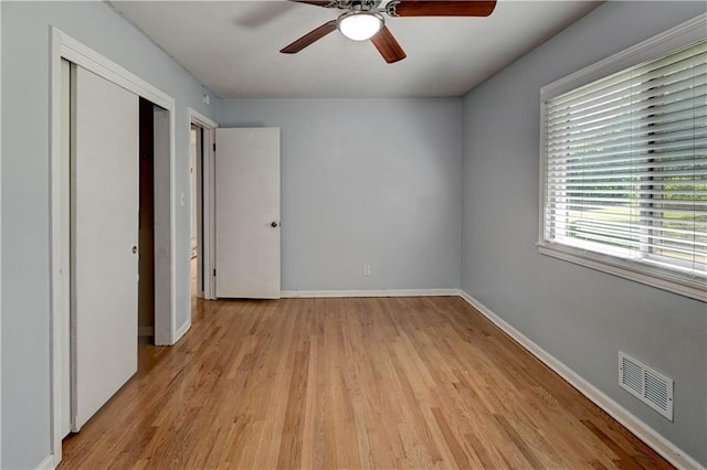 7907 Elm Ave, Raytown, MO 64138 - unfurnished bedroom with light wood finished floors, a closet, and a ceiling fan