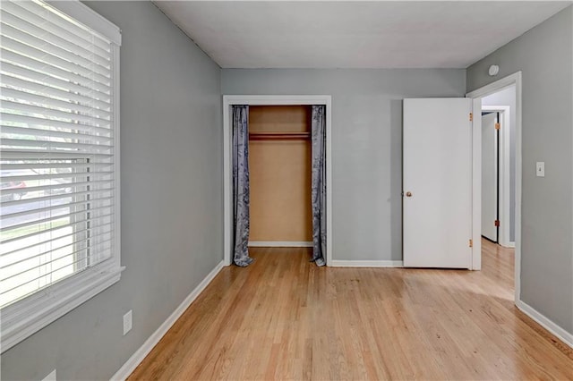 7907 Elm Ave, Raytown, MO 64138 - unfurnished bedroom with light wood-type flooring and a closet
