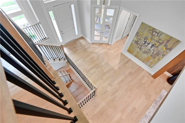15601 Catalina St, Overland Park, KS 66224 - entrance foyer featuring wood finished floors, stairway, french doors, and baseboards