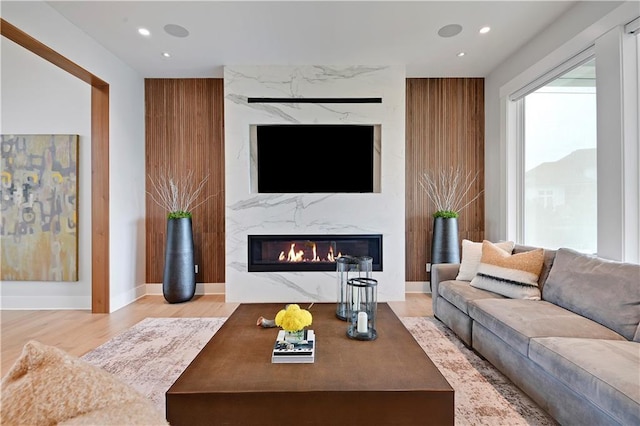 15601 Catalina St, Overland Park, KS 66224 - living area featuring a fireplace, wood finished floors, recessed lighting, and baseboards