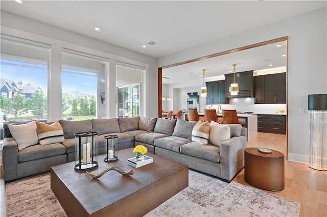 15601 Catalina St, Overland Park, KS 66224 - living room with light wood-style flooring and recessed lighting