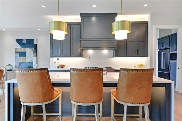 15601 Catalina St, Overland Park, KS 66224 - kitchen featuring stainless steel microwave, high end fridge, light countertops, decorative backsplash, and recessed lighting