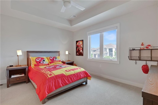 15601 Catalina St, Overland Park, KS 66224 - bedroom with light colored carpet, a raised ceiling, and baseboards