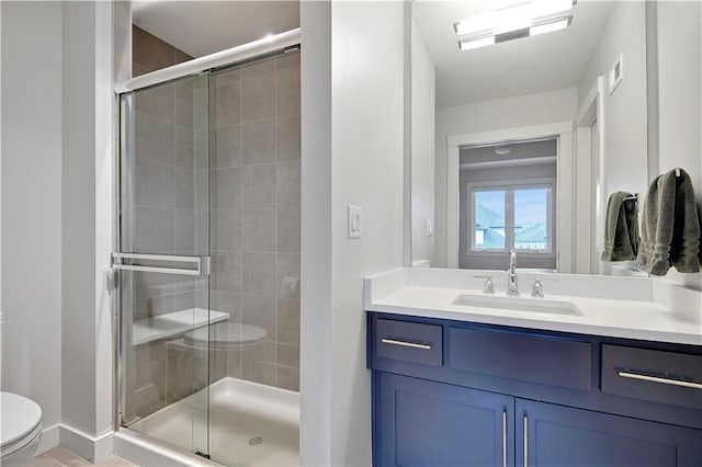 15601 Catalina St, Overland Park, KS 66224 - bathroom with toilet, vanity, a stall shower, baseboards, and tile patterned flooring
