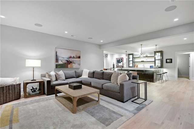 15601 Catalina St, Overland Park, KS 66224 - living area featuring light wood finished floors and recessed lighting