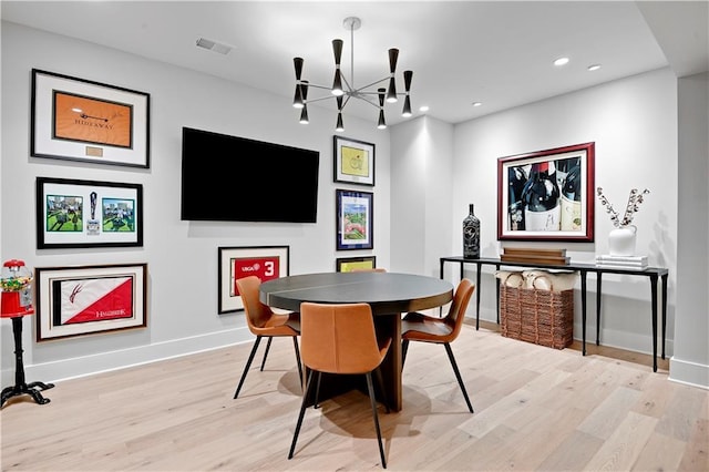 15601 Catalina St, Overland Park, KS 66224 - dining space with light wood-type flooring, a chandelier, baseboards, and recessed lighting