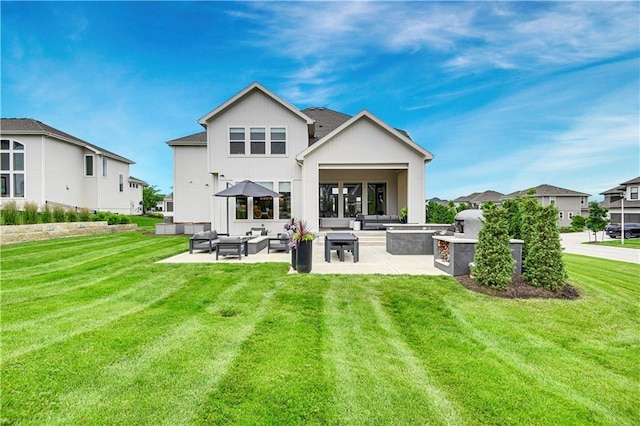 15601 Catalina St, Overland Park, KS 66224 - rear view of property featuring an outdoor hangout area, a patio area, and a yard
