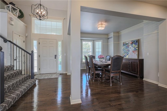 23856 W 124th Ct, Olathe, KS 66061 - foyer entrance featuring dark wood-type flooring, a chandelier, and stairway
