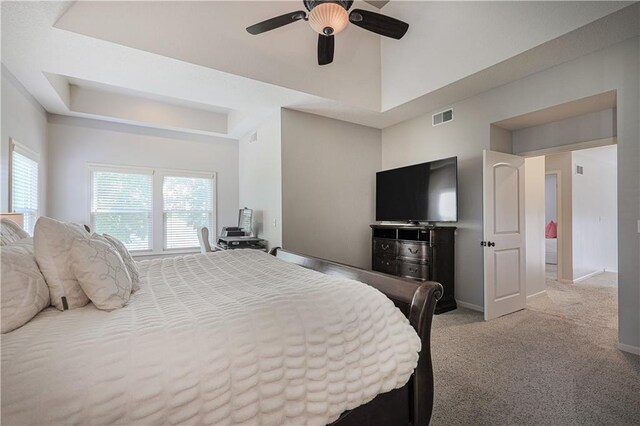 23856 W 124th Ct, Olathe, KS 66061 - carpeted bedroom with a tray ceiling and ceiling fan