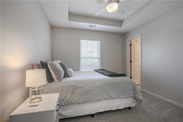 23856 W 124th Ct, Olathe, KS 66061 - bedroom with a raised ceiling, carpet floors, and a ceiling fan