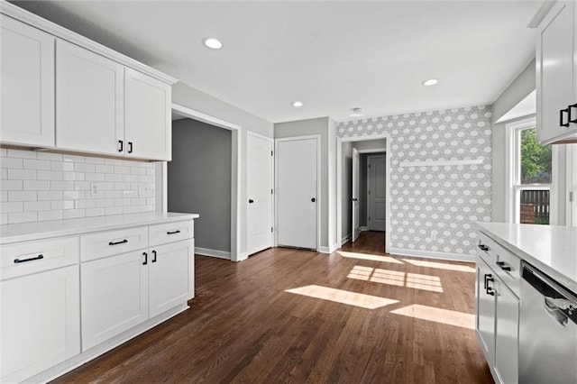 12001 S Hagan St, Olathe, KS 66062 - kitchen featuring stainless steel dishwasher, light countertops, baseboards, wallpapered walls, and dark wood-style flooring