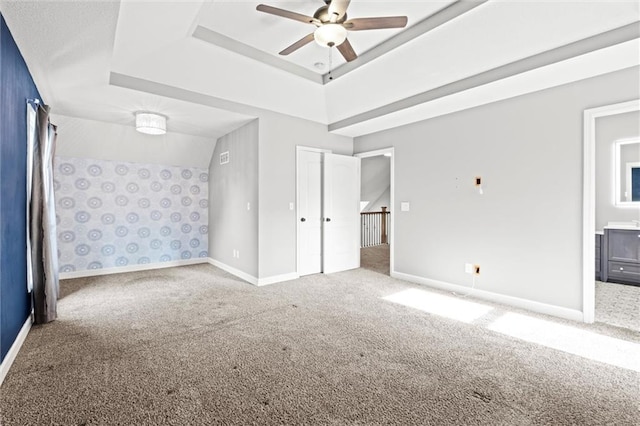 12001 S Hagan St, Olathe, KS 66062 - unfurnished bedroom featuring carpet, a raised ceiling, and baseboards