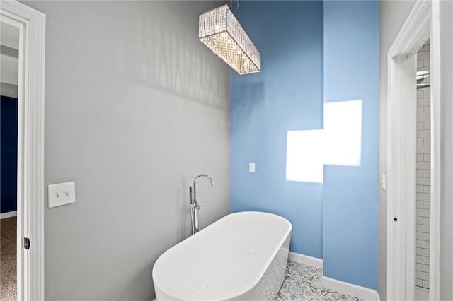 12001 S Hagan St, Olathe, KS 66062 - full bath with a freestanding tub and baseboards
