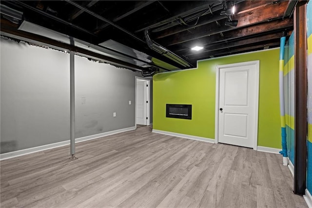 12001 S Hagan St, Olathe, KS 66062 - finished basement with wood finished floors and baseboards