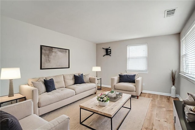 6005 NE 50th St, Kansas City, MO 64119 - living area featuring light wood-type flooring and baseboards
