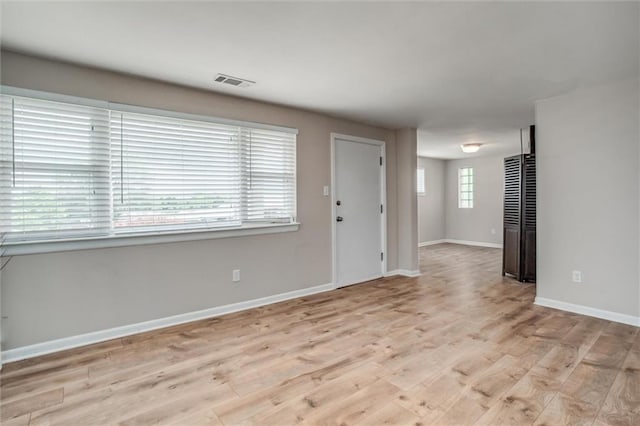 6005 NE 50th St, Kansas City, MO 64119 - unfurnished living room with light wood-style floors and baseboards
