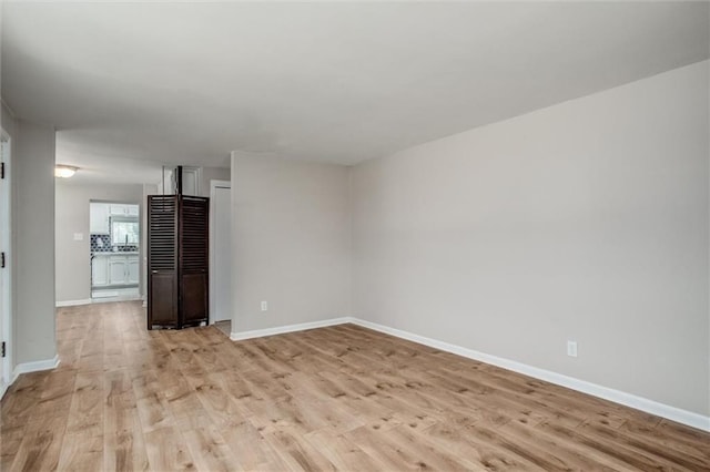 6005 NE 50th St, Kansas City, MO 64119 - unfurnished room with light wood-style floors