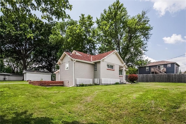 6005 NE 50th St, Kansas City, MO 64119 - view of home's exterior featuring stucco siding