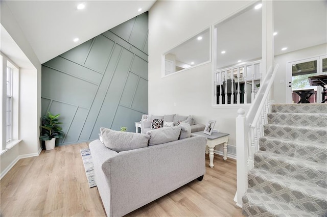 513 Forestglen Ln, Lansing, KS 66043 - living area featuring light wood finished floors and a decorative wall