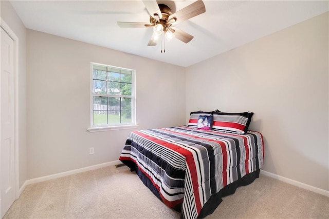 513 Forestglen Ln, Lansing, KS 66043 - carpeted bedroom with baseboards and ceiling fan