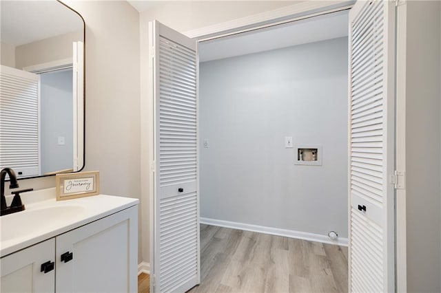 513 Forestglen Ln, Lansing, KS 66043 - bathroom featuring wood finished floors and vanity